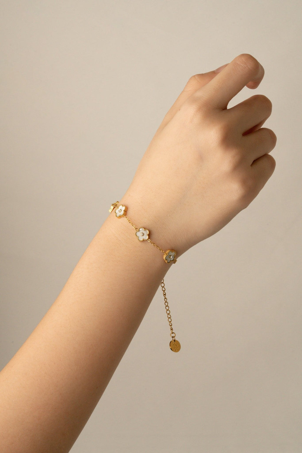 Model wearing MNML Floral Clovers Bracelet on wrist — delicate clover bracelet everyday Malaysia 