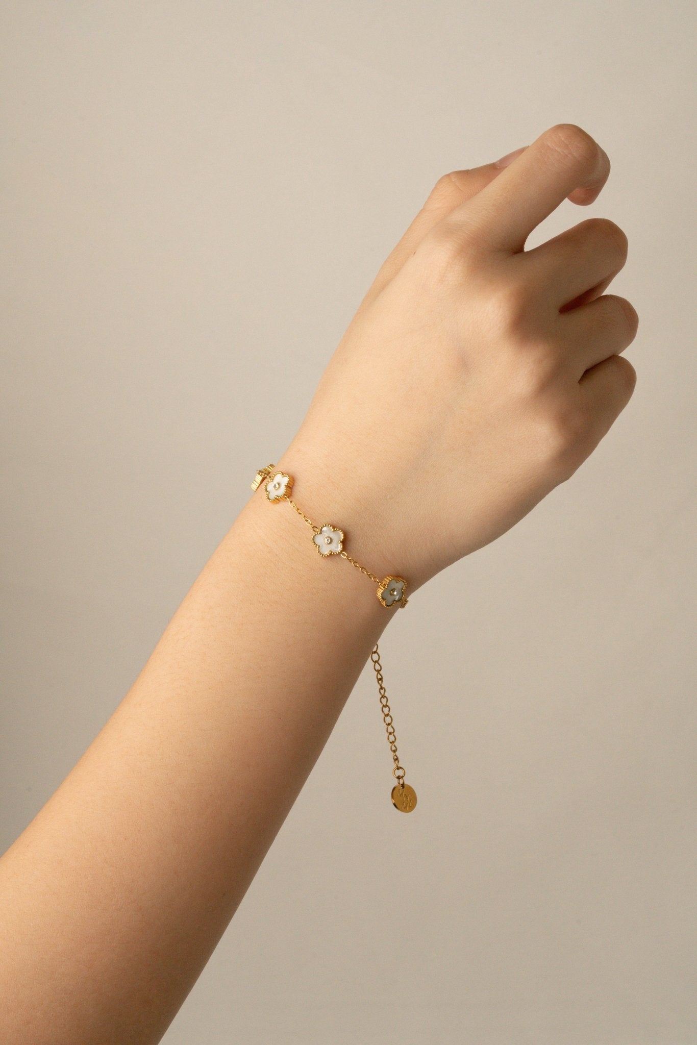 Model wearing MNML Floral Clovers Bracelet on wrist — delicate clover bracelet everyday Malaysia 
