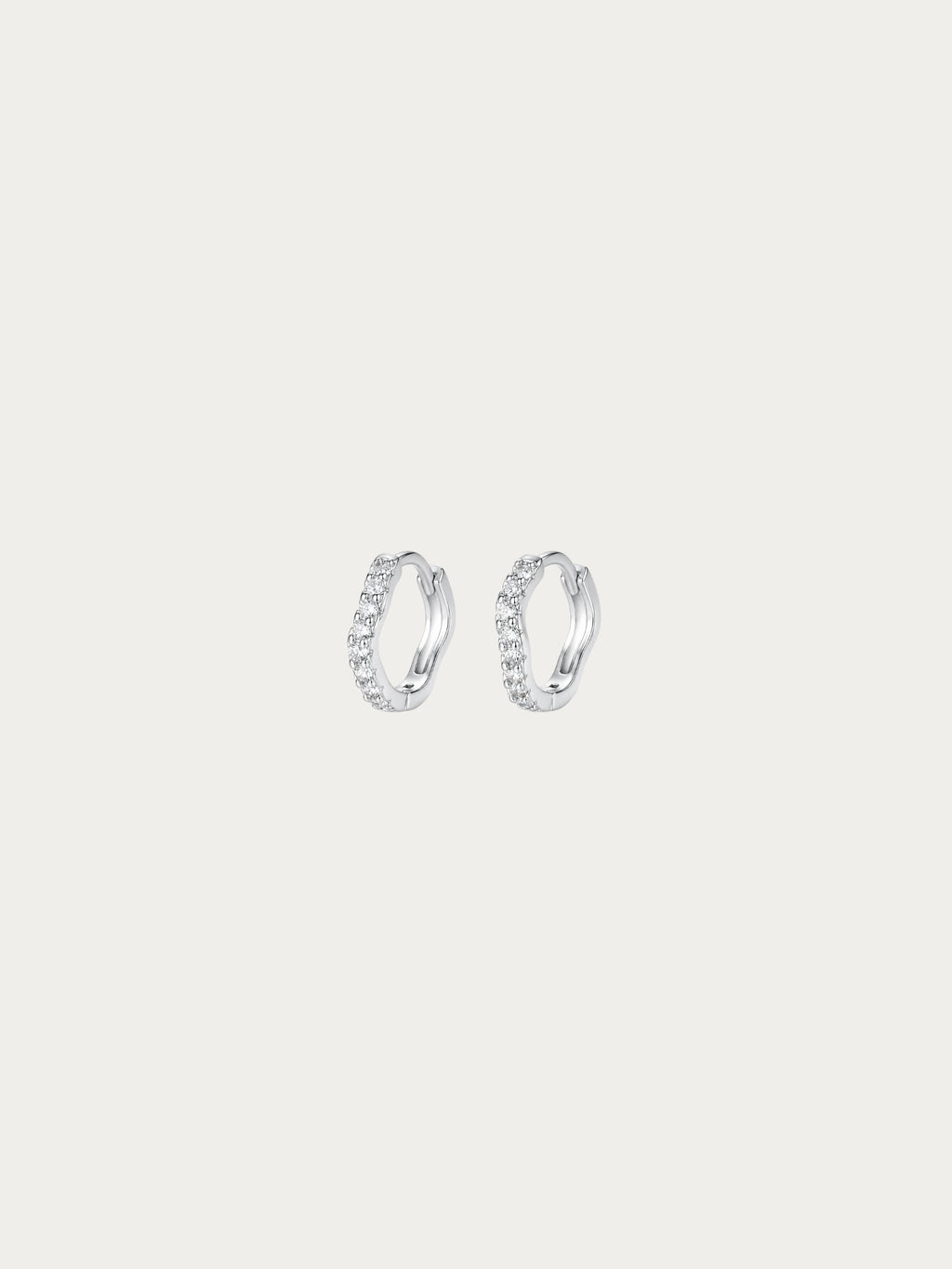 Flowy Paved Essential Huggie Earrings with a single wavy row of pavé CZ in rhodium-plated 925 sterling silver, front view