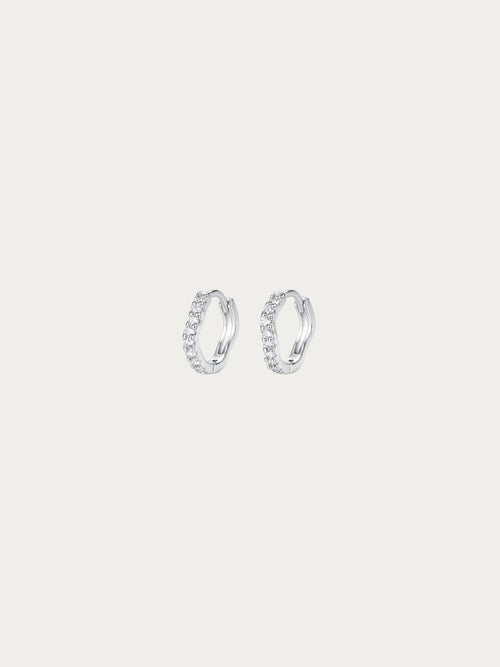 Flowy Paved Essential Huggie Earrings with a single wavy row of pavé CZ in rhodium-plated 925 sterling silver, front view