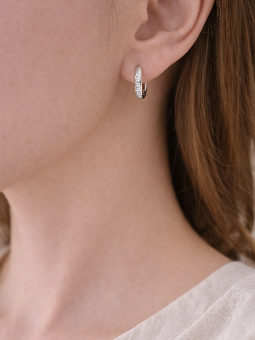 Giovanna huggie earring worn on the ear