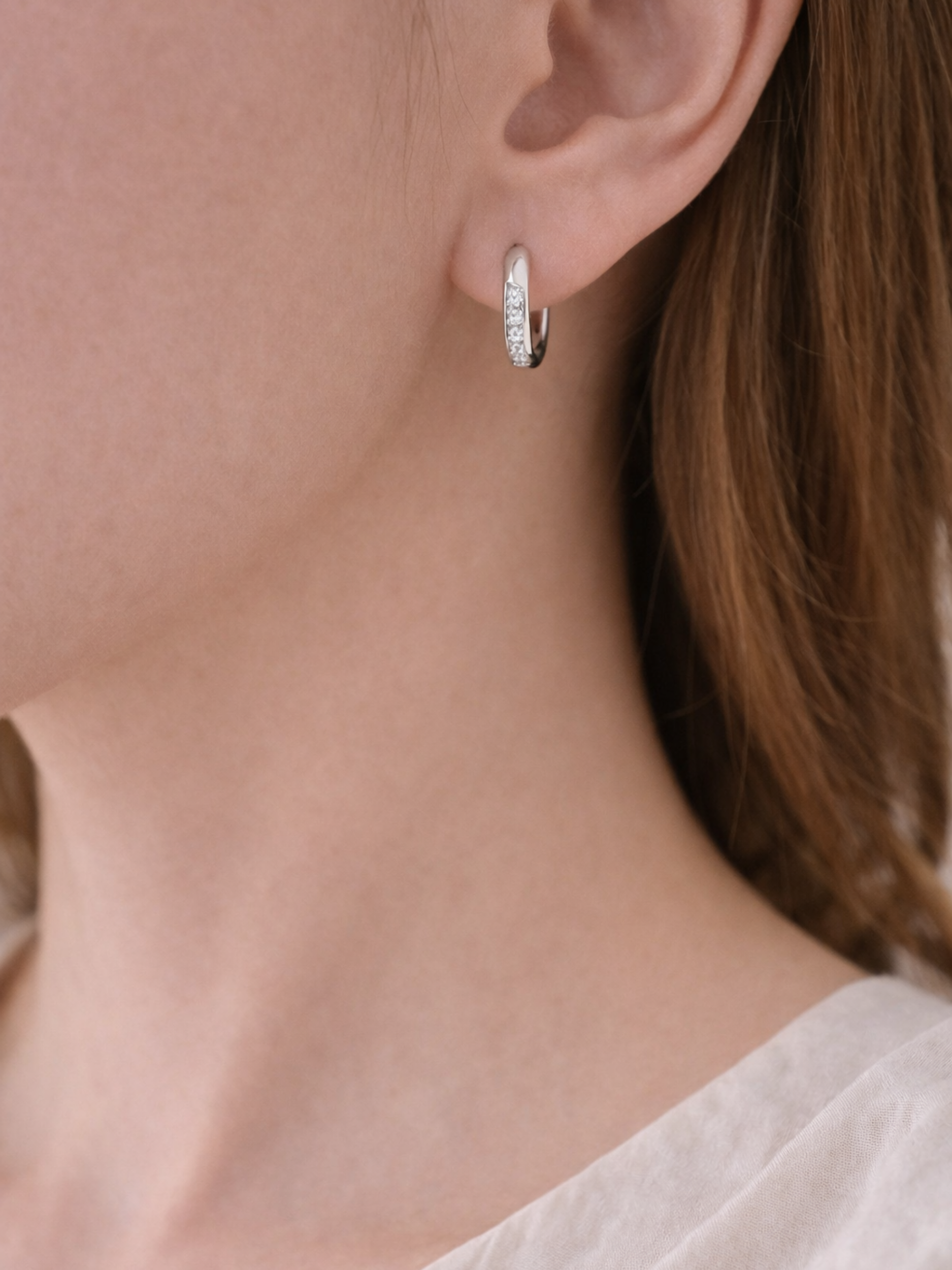 Giovanna huggie earring worn on the ear