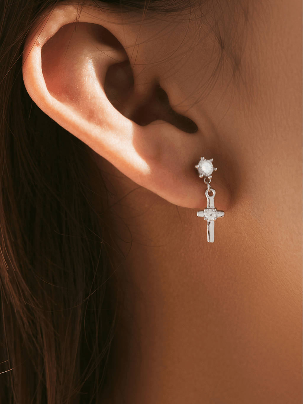 Side view of Glint cross drop earring showing CZ stud and cross detail