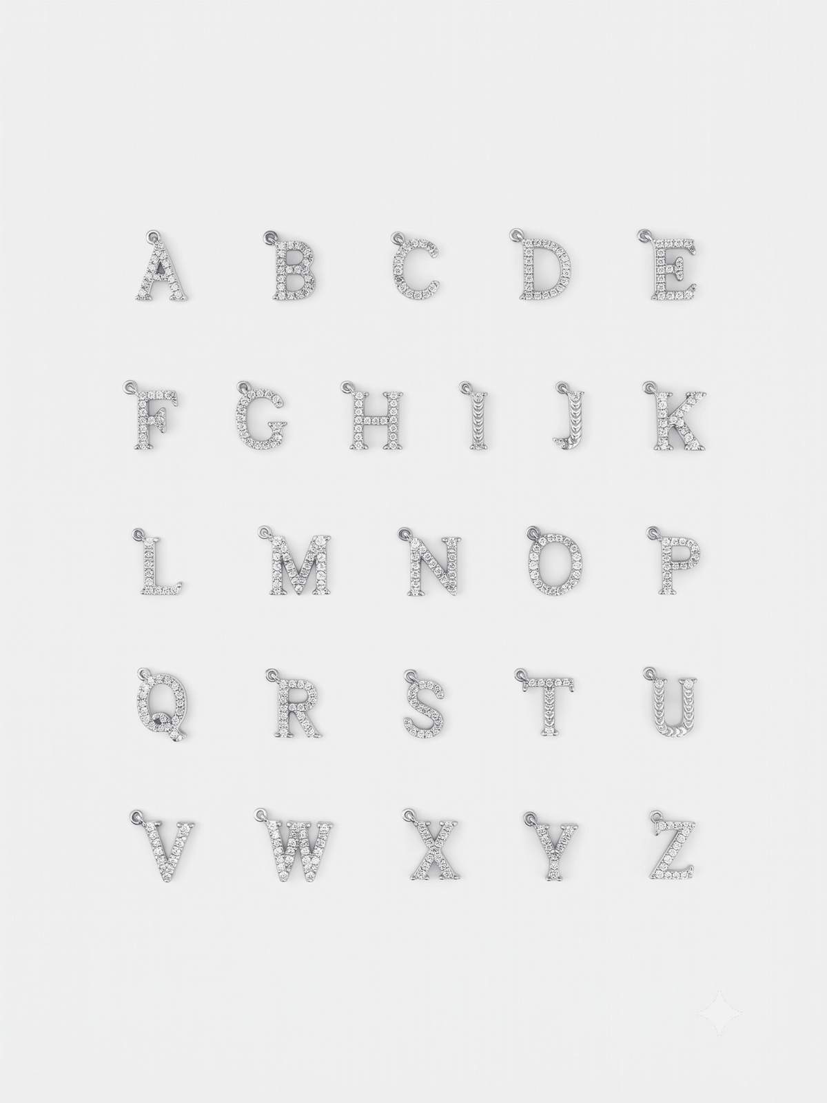 Initial alphabet pendants from A to Z laid out in a flatlay
