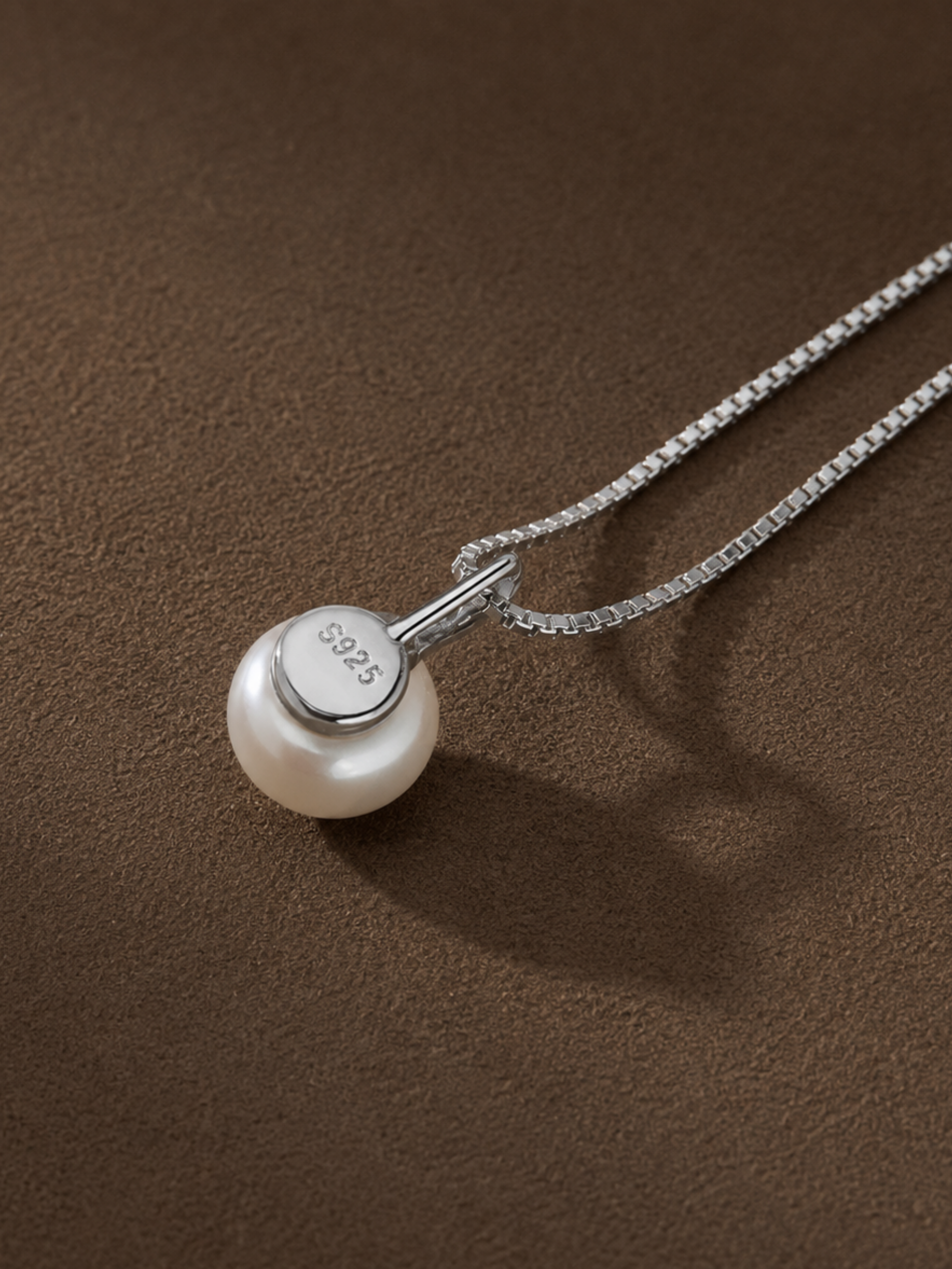 Flat lay of MNML Isabelle Minimalist Pearl Necklace — 925 silver rhodium freshwater pearl jewelry
