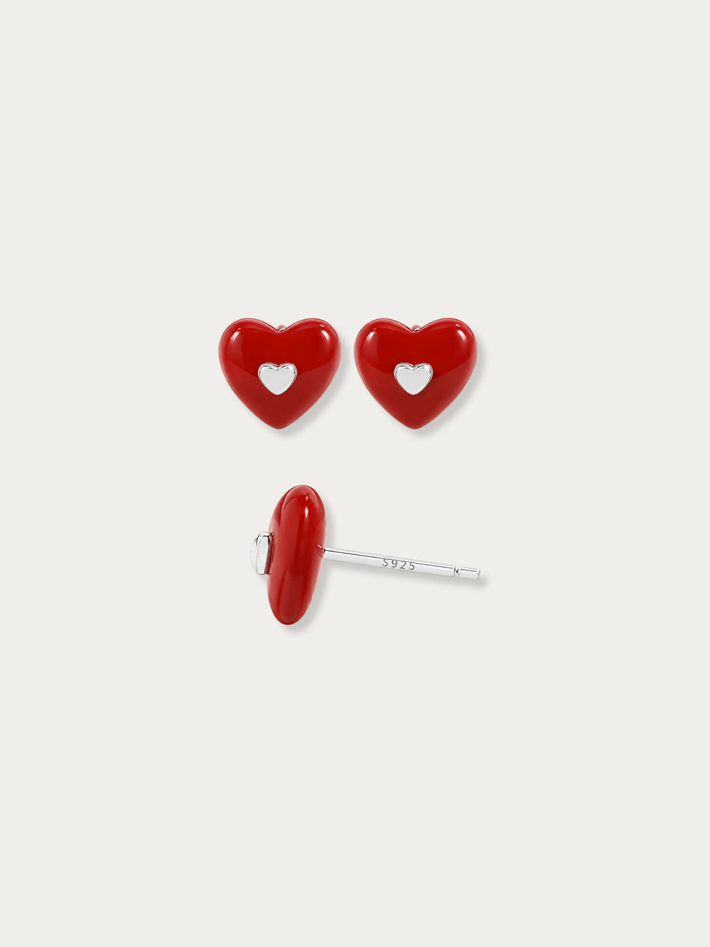 Close-up of the cutout centre revealing a small silver heart beneath the glossy red heart
