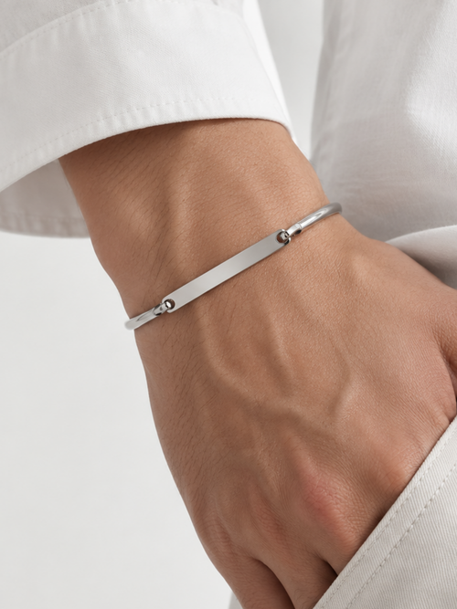 Julius bar bangle worn on a man's wrist