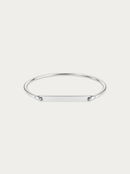Julius engravable bar bangle in silver-tone stainless steel with a long flat bar, front view