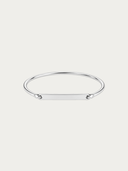 Julius engravable bar bangle in silver-tone stainless steel with a long flat bar, front view