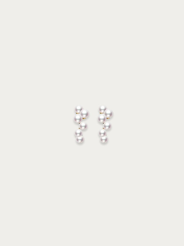 Pair of Kaela Pearl Earrings laid flat