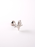 Close-up of starburst silhouette on MNML Kepler 925 silver rhodium barbell stud — celestial detail
