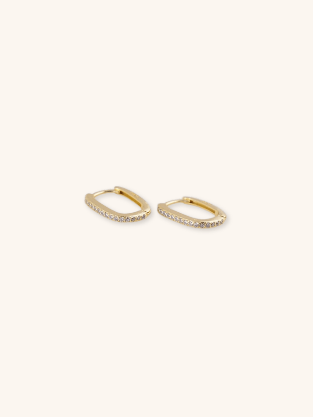 Close-up of LEVI oval hoop earring in Gold finish