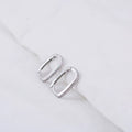 Close-up of LEVI oval hoop earring in Silver finish