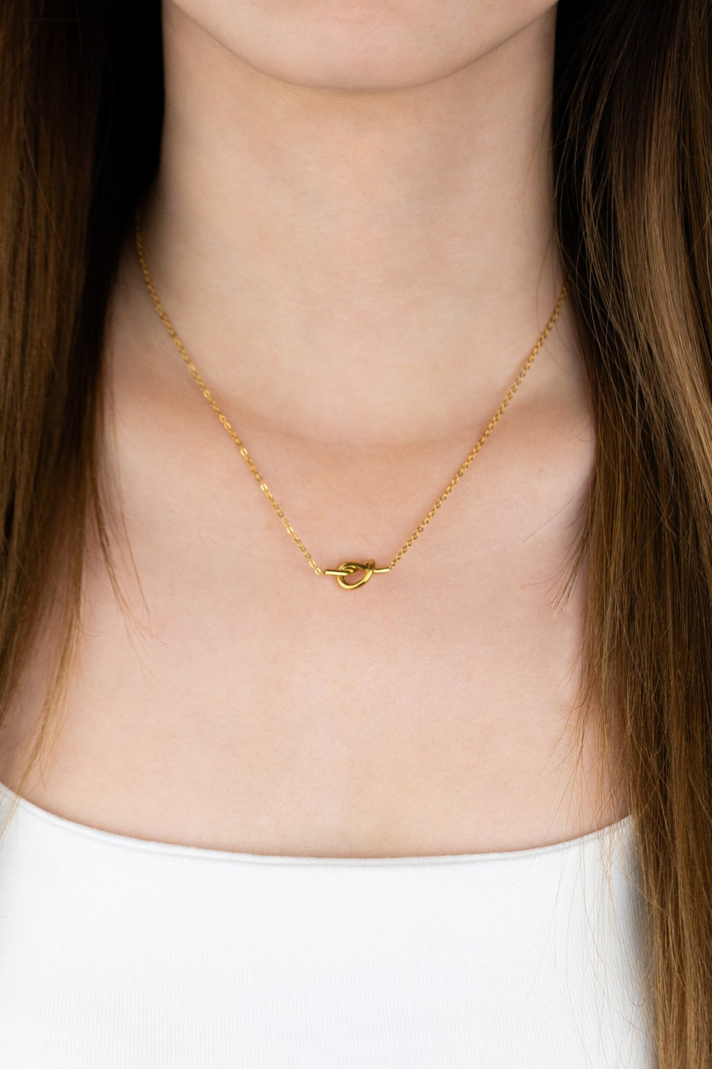 Close-up of fixed knot centrepiece on MNML Love Me Knot Necklace — symbolic knot detail