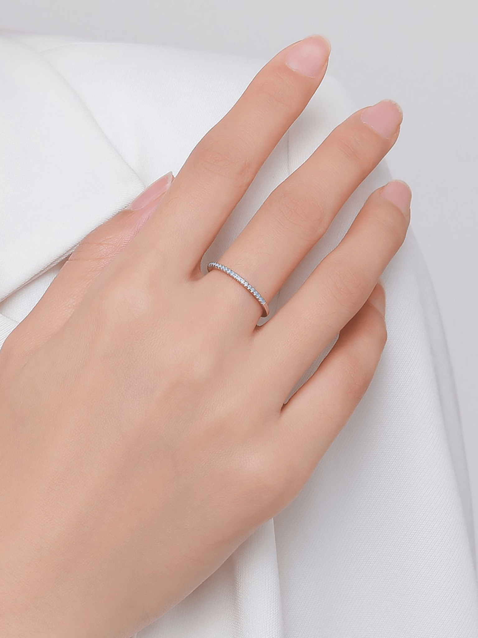 Blue CZ close-up on MNML LYCIA Pavé Ring — soft powder blue stone half eternity band