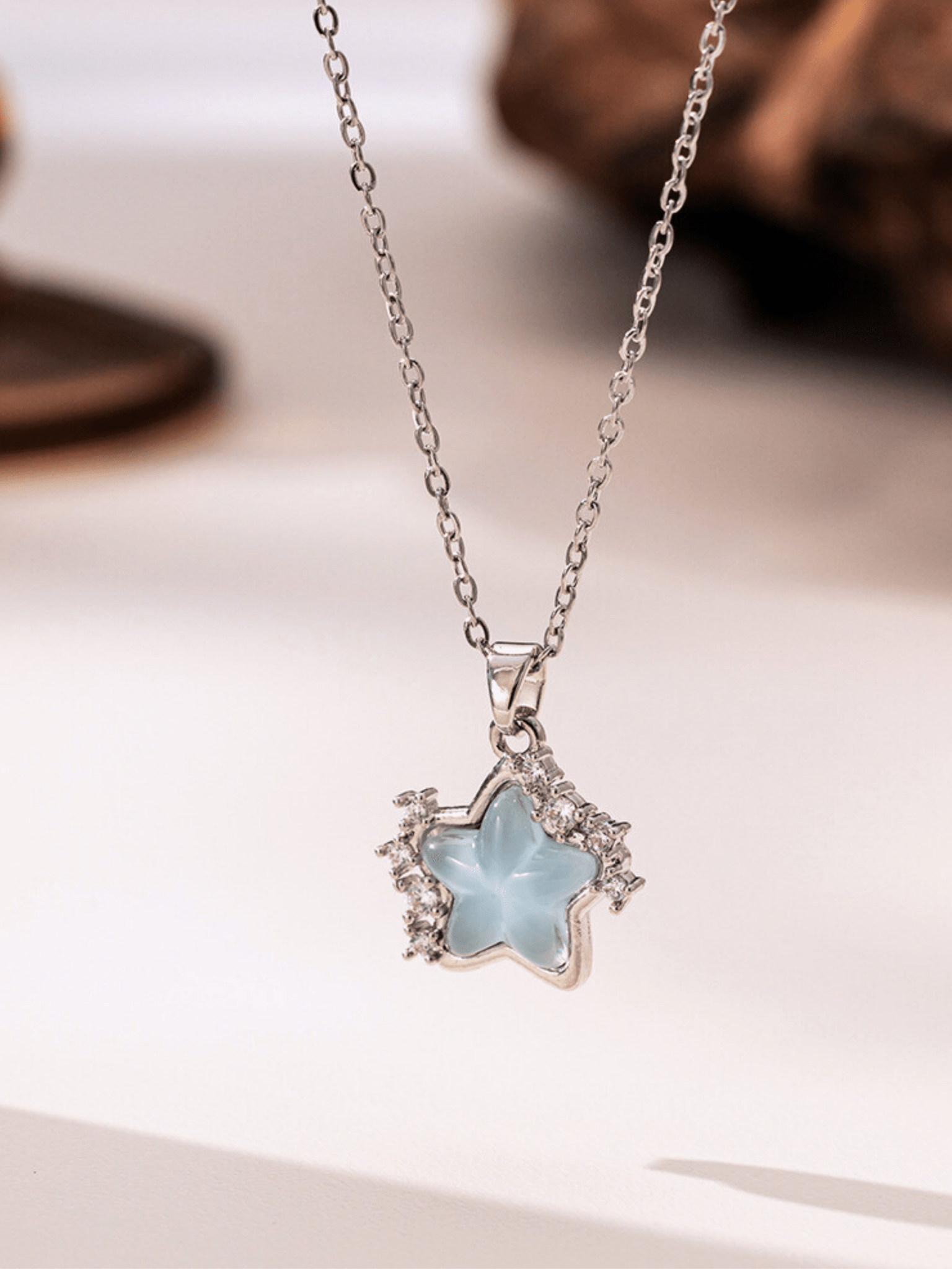 Close-up of star-shaped pendant on Marin Star Necklace