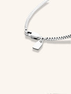 Close-up of 2mm box links on MNML Minimalist Box Chain Necklace — square link titanium detail