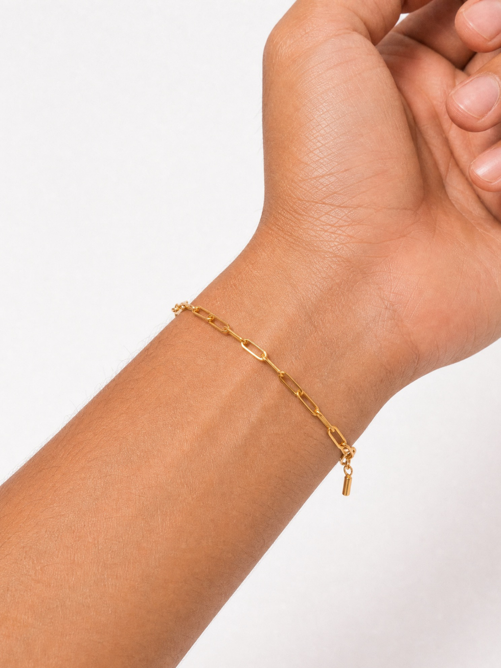 Male model wearing MNML Minimalist Paperclip Chain Bracelet in gold — 18cm titanium bracelet for him Malaysia