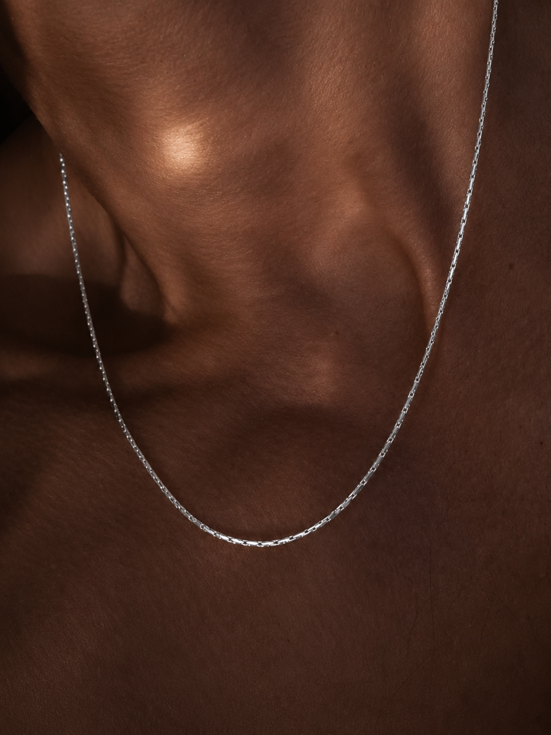 Flat lay of MNML Minimalist Wheat Chain Necklace — 316L stainless steel everyday jewelry Malaysia