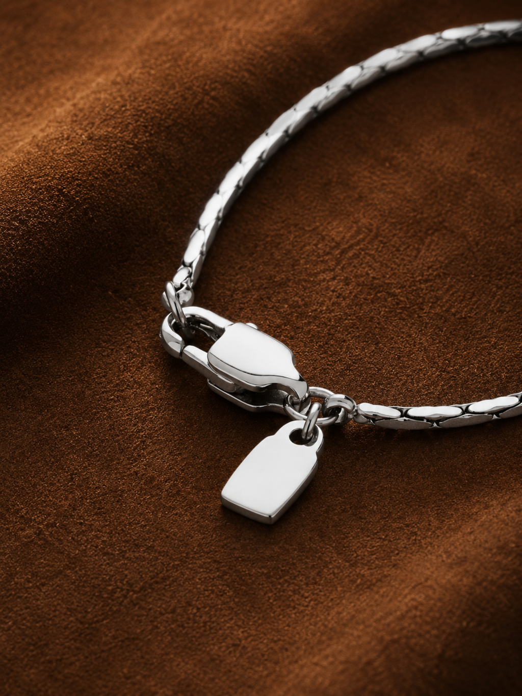 Rectangular tag pendant detail on MNML Minimalist Wheat Chain Necklace — 4mm×8mm polished steel tag