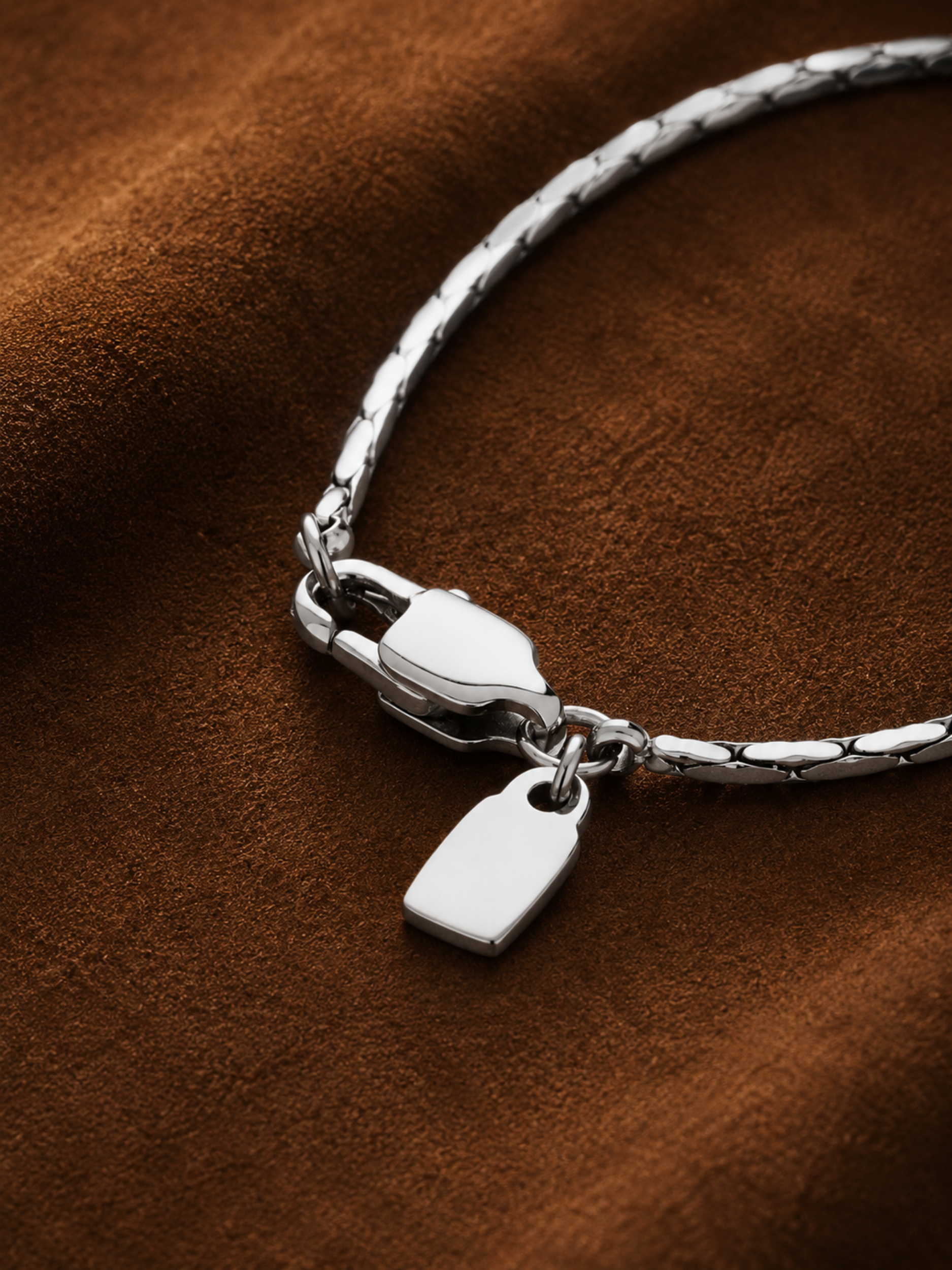 Rectangular tag pendant detail on MNML Minimalist Wheat Chain Necklace — 4mm×8mm polished steel tag