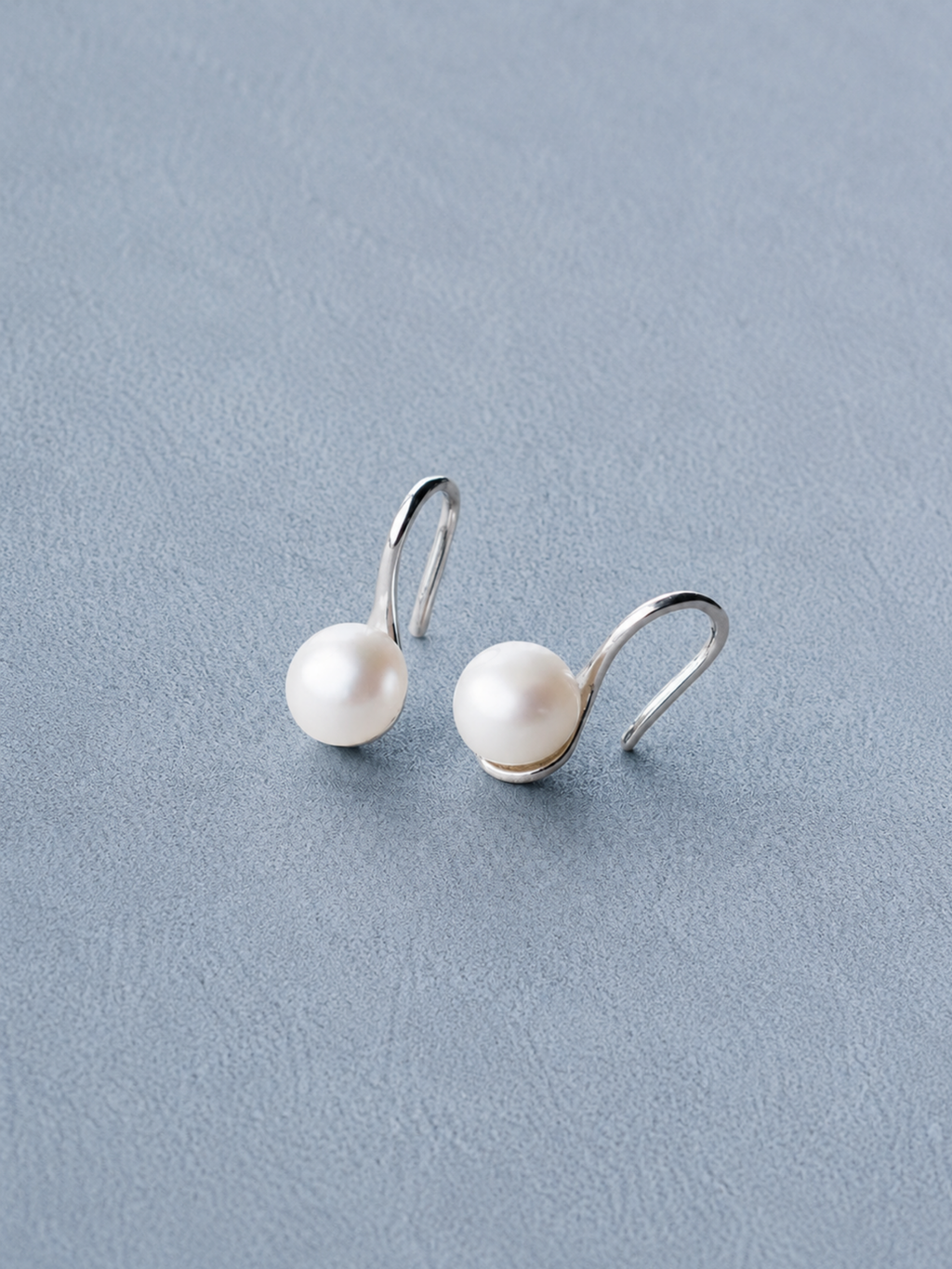 Close-up of natural freshwater pearl on MNML Mira Pearl Drop Earrings — soft lustre detail