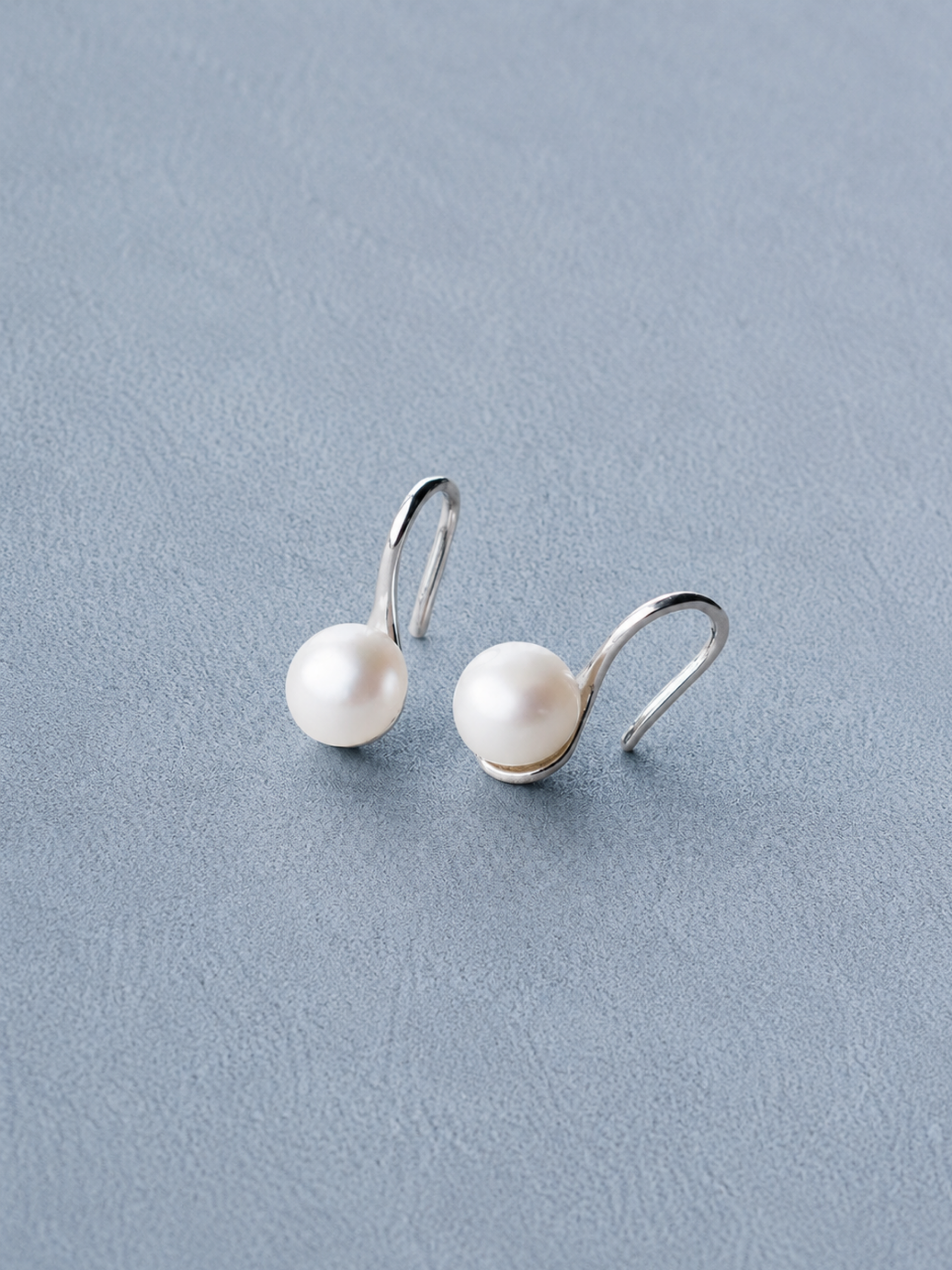 Close-up of natural freshwater pearl on MNML Mira Pearl Drop Earrings — soft lustre detail