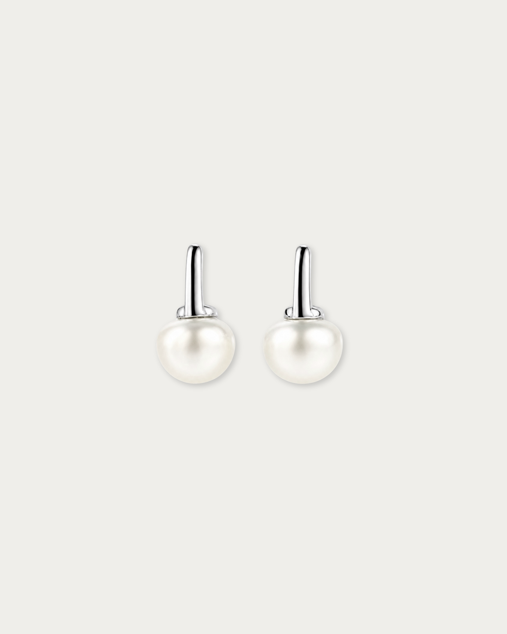 Pair of Miyu Freshwater Pearl Drop Stud Earrings laid flat