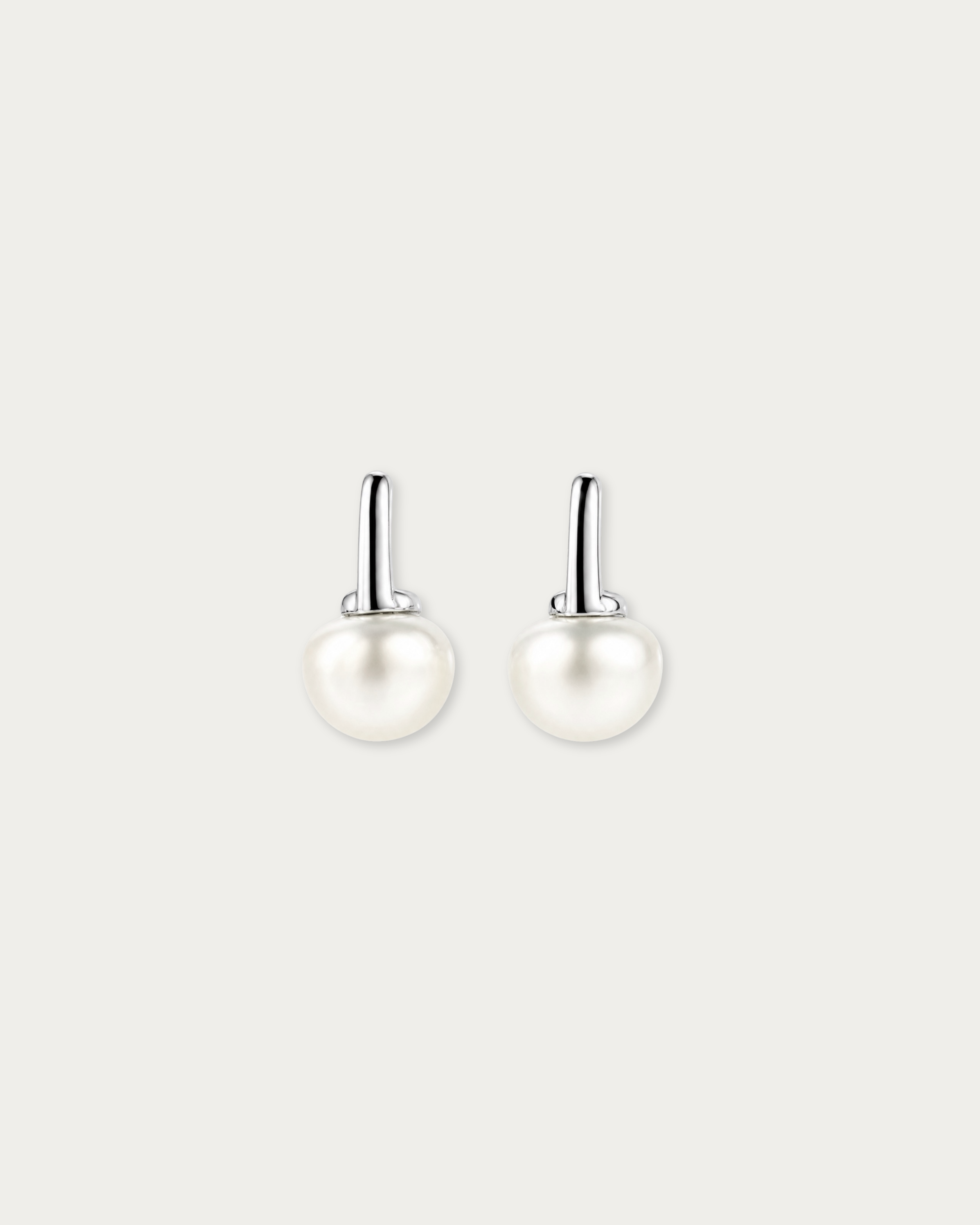 Pair of Miyu Freshwater Pearl Drop Stud Earrings laid flat