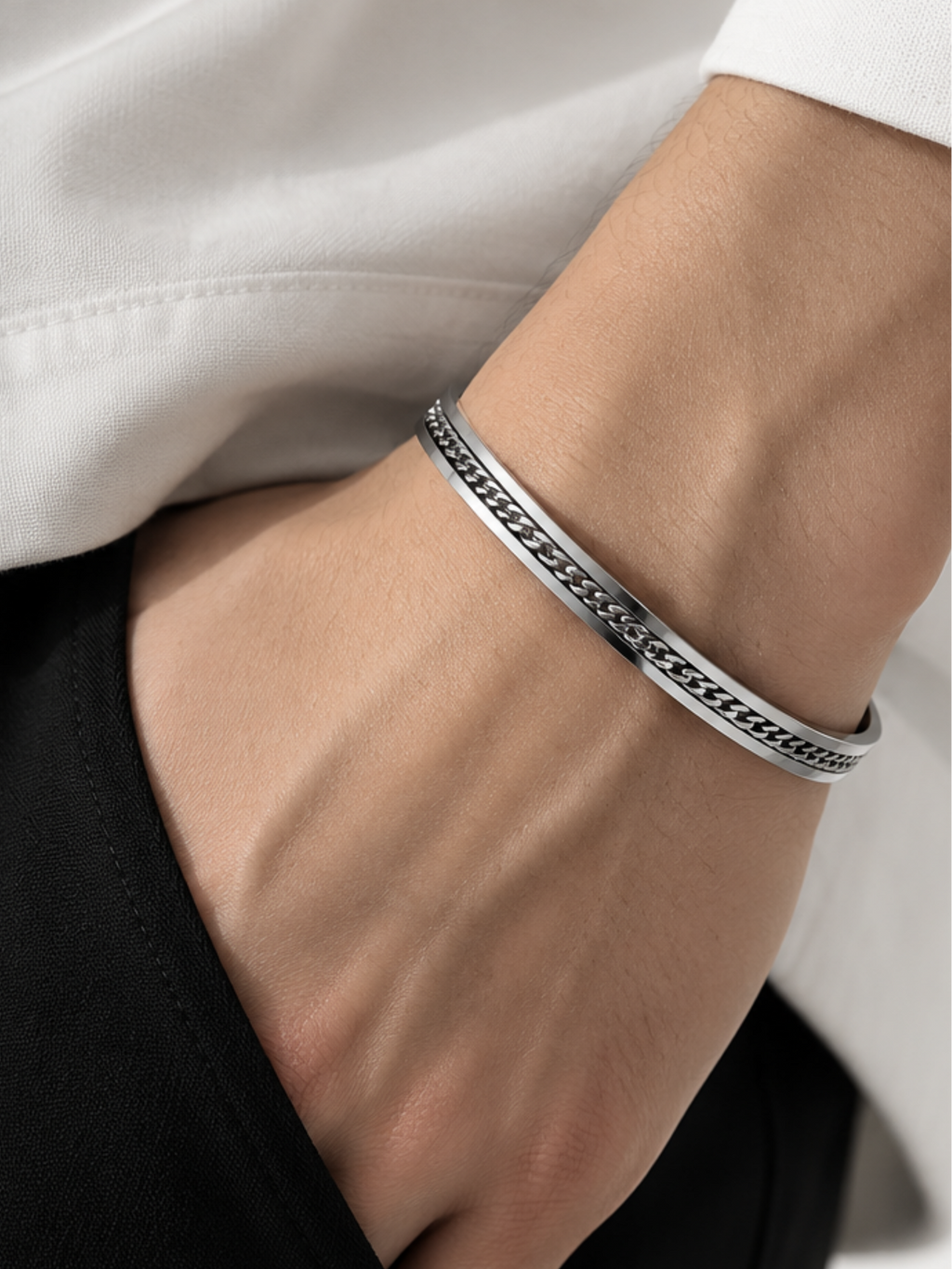 Mono Chain Bangle worn on a man's wrist with a white shirt cuff