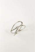 close up intertwined loop silver ring sculptural detail