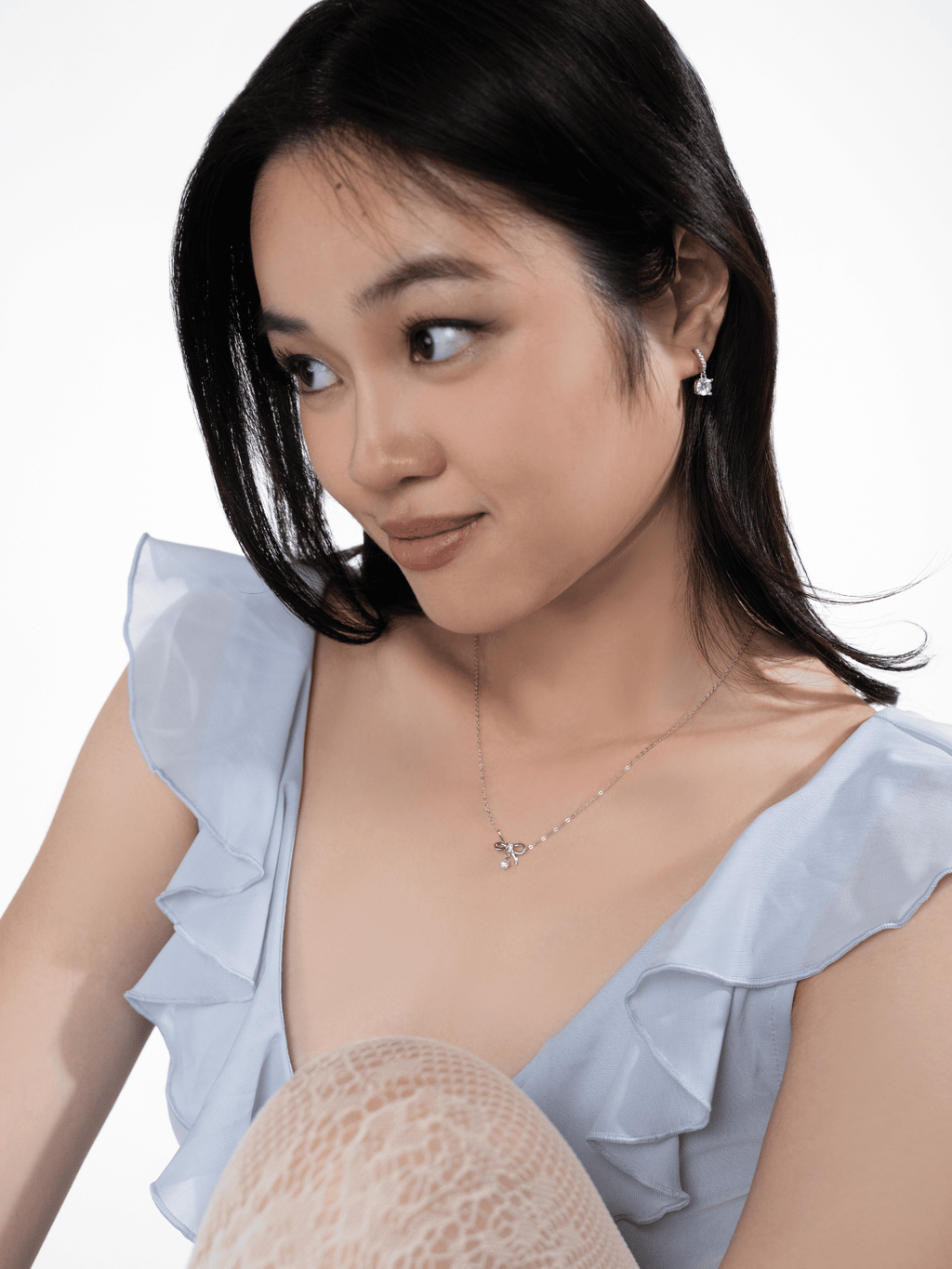 Nora Grace round drop earring worn on the ear