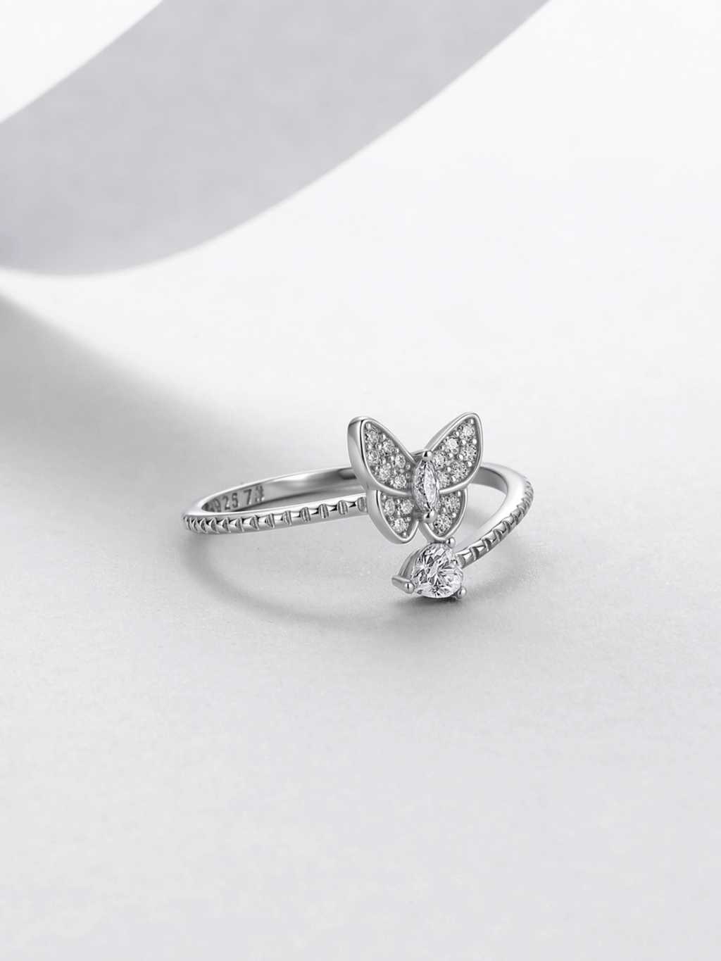 Close-up of the moissanite butterfly cluster on the Odette ring