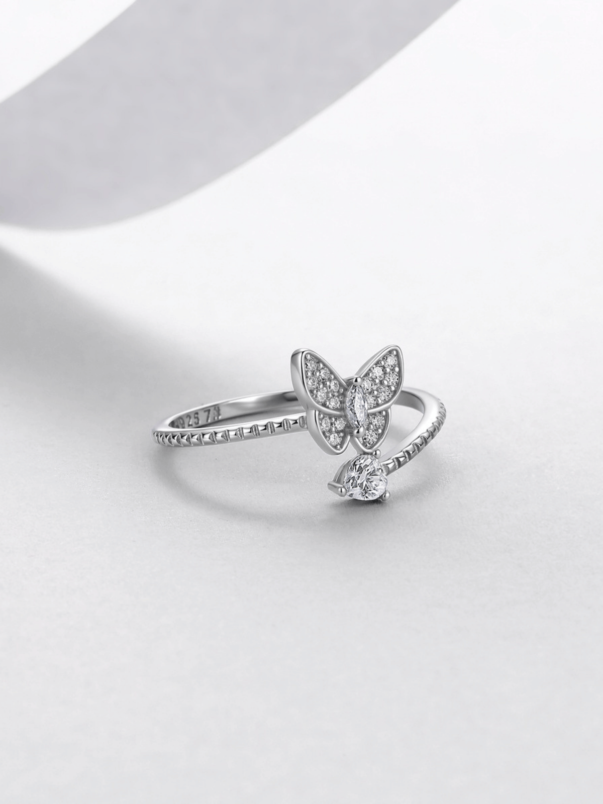 Close-up of the moissanite butterfly cluster on the Odette ring