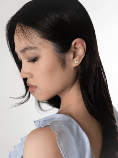 Piper Bloom moissanite clover stud worn on the ear lobe