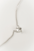 Close-up of three-prong 4mm CZ setting on MNML Pragma Solitaire Necklace — minimal solitaire detail