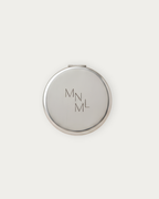 MNML Reflection Pocket Mirror closed, showing engraved MNML logo