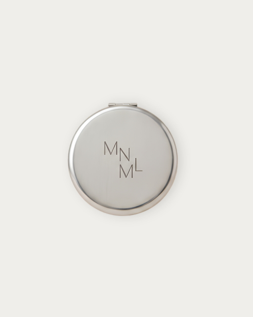 MNML Reflection Pocket Mirror closed, showing engraved MNML logo