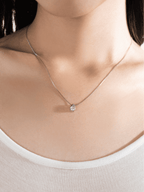 Close-up of the D colour moissanite held in the smooth teardrop bezel