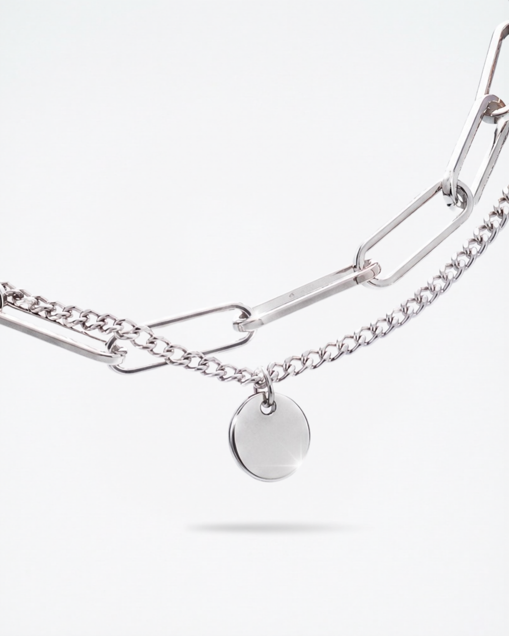 Close-up of 8mm engravable disc charm on MNML Rory Paperclip Bracelet — personalised disc detail