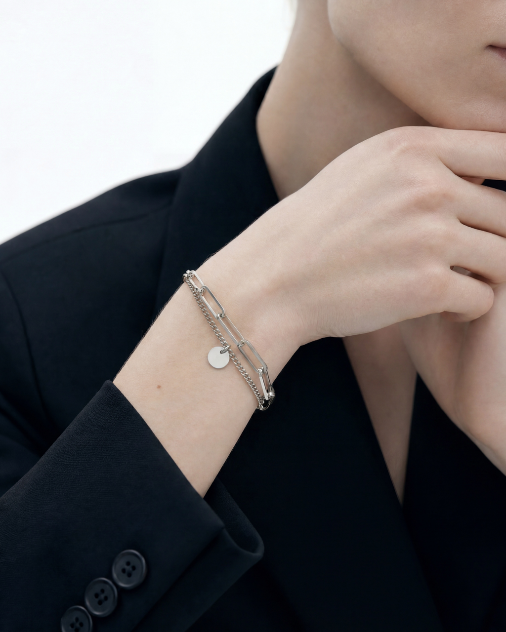 Close-up of 8mm engravable disc charm on MNML Rory Paperclip Bracelet — personalised disc detail