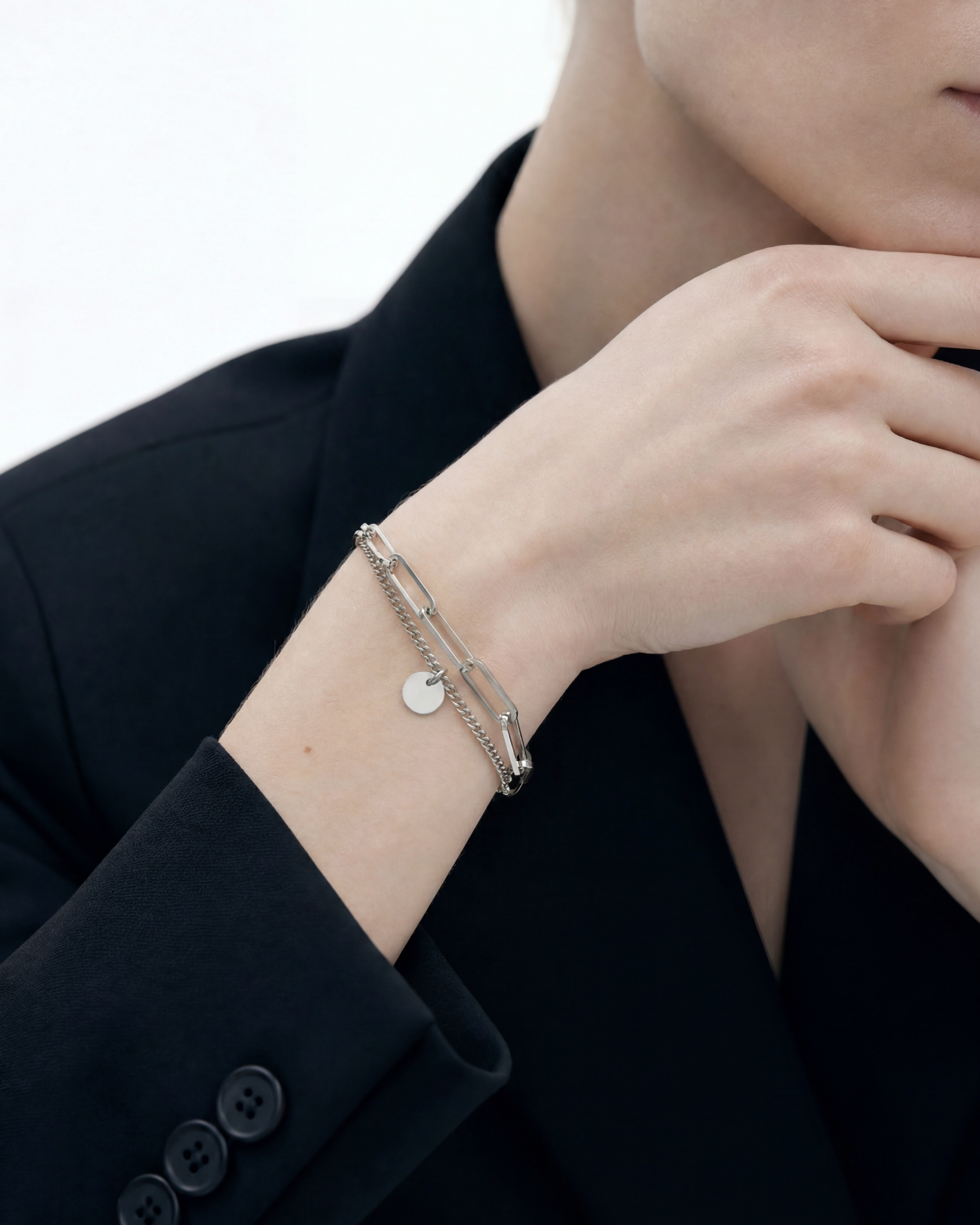 Close-up of 8mm engravable disc charm on MNML Rory Paperclip Bracelet — personalised disc detail