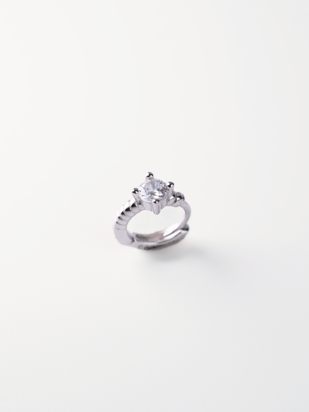 5A CZ solitaire close-up on MNML Selene Rope Crystal Huggie — four-prong crystal detail