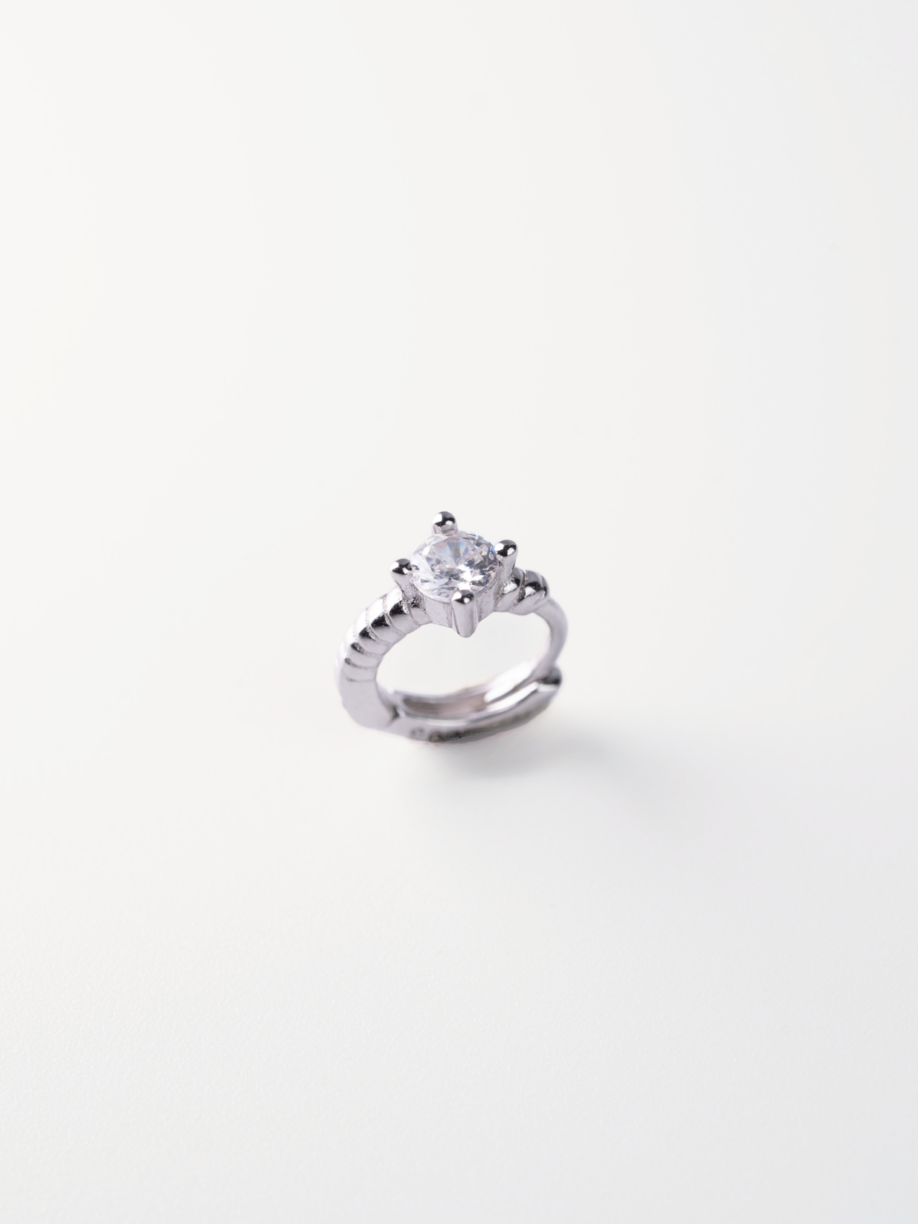 5A CZ solitaire close-up on MNML Selene Rope Crystal Huggie — four-prong crystal detail
