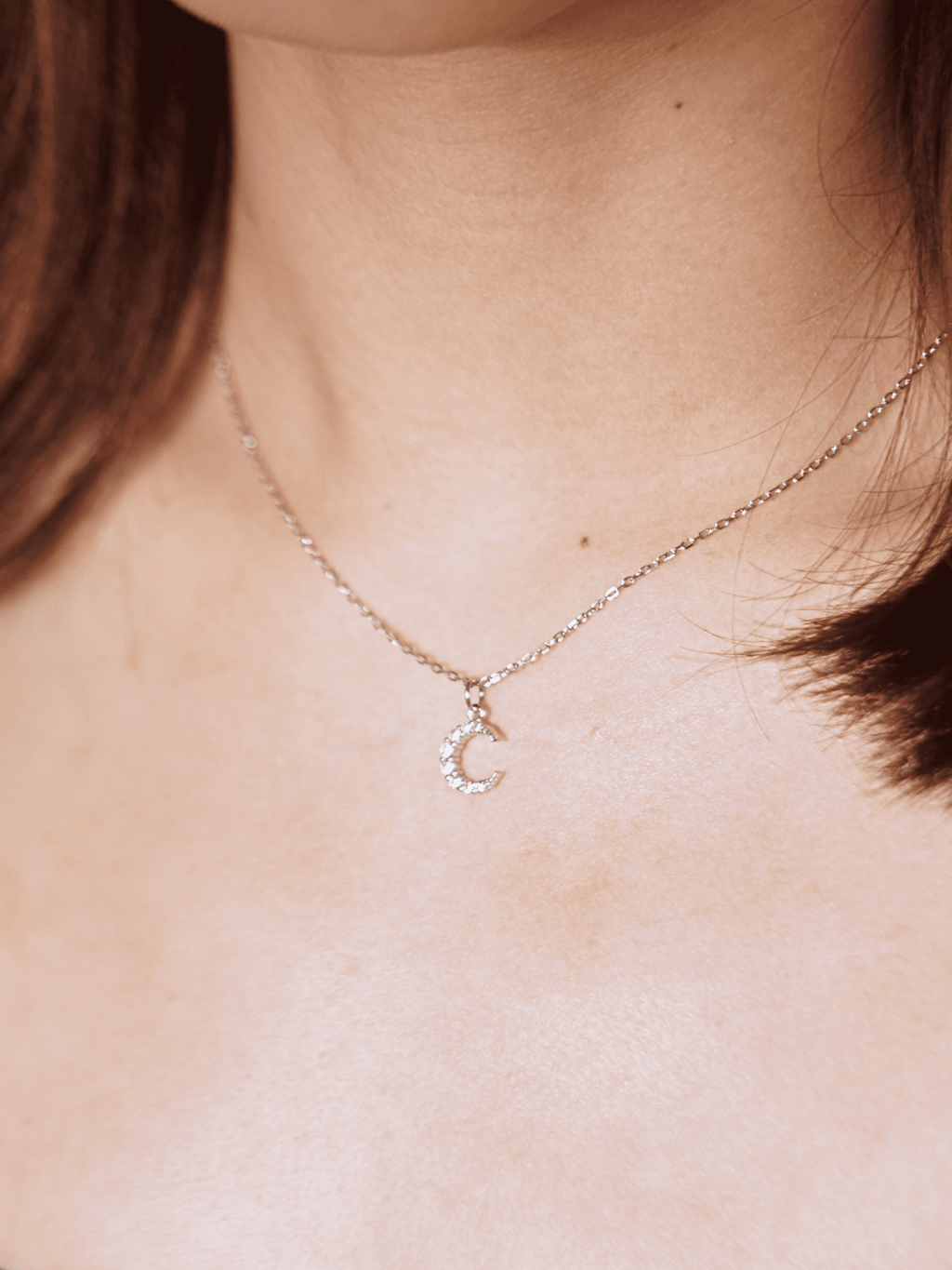Close-up of crescent moon pendant on MNML SIERRA Necklace — CZ moon pendant 925 silver