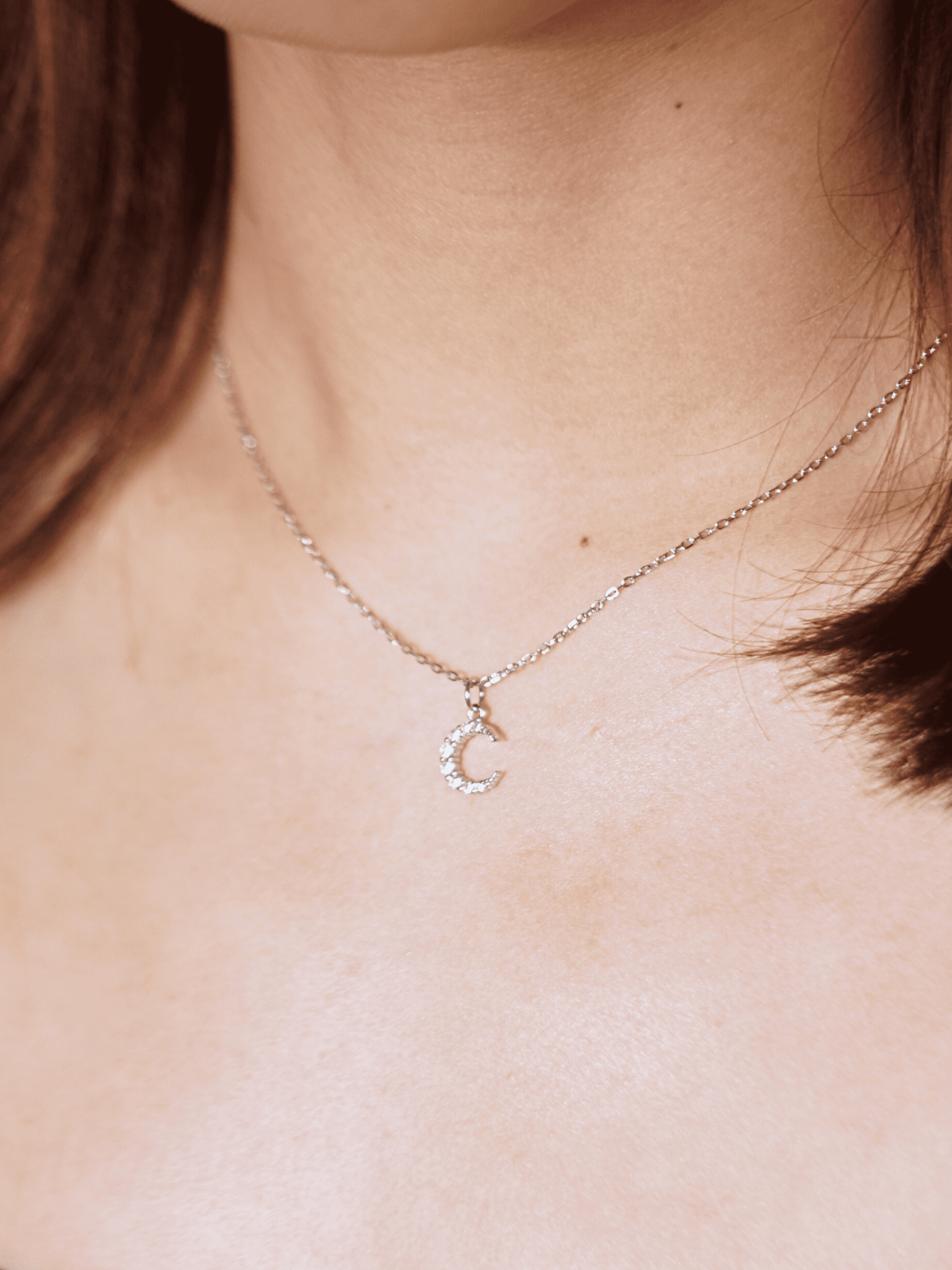 Close-up of crescent moon pendant on MNML SIERRA Necklace — CZ moon pendant 925 silver