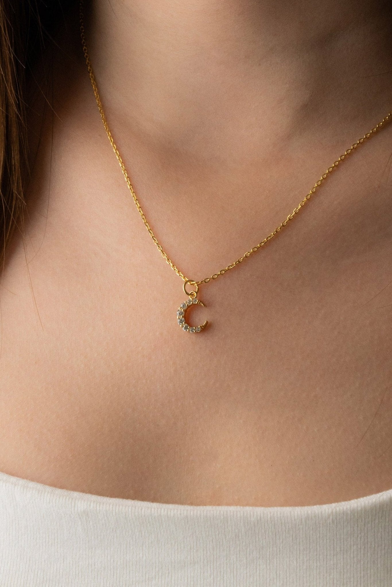 Model wearing MNML SIERRA Sparkling Moon Necklace in gold colour at collarbone — symbolic moon necklace Malaysia