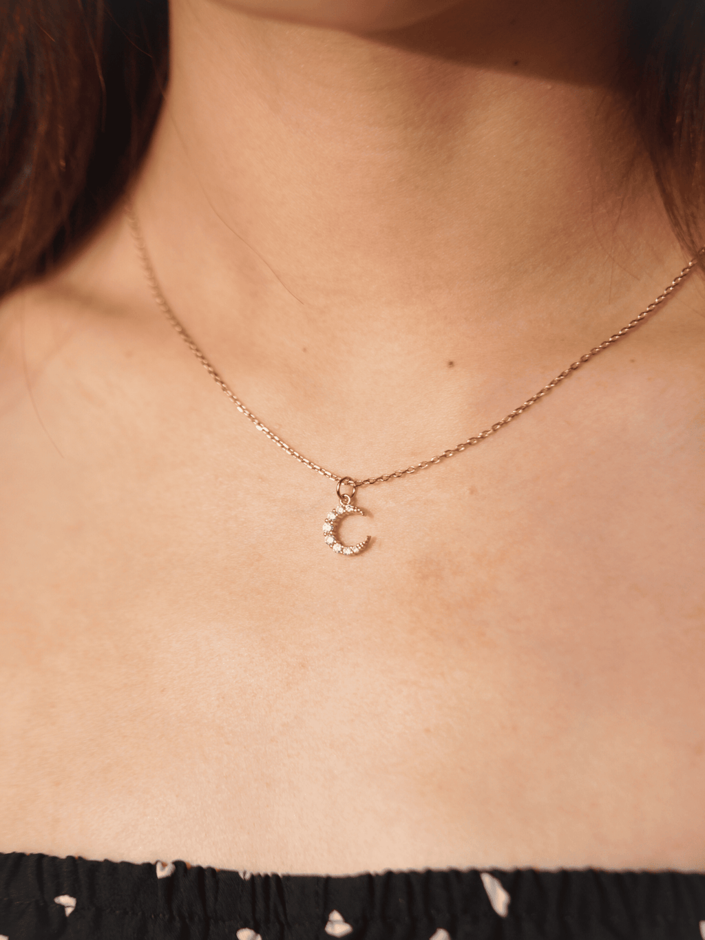 Model wearing MNML SIERRA Sparkling Moon Necklace in rose gold colour  at collarbone — symbolic moon necklace Malaysia