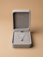 MNML Signature Case open, showing moissanite necklace inside 