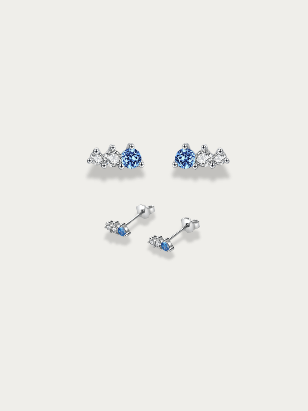 Sky Glimmer Stud Earrings with three-stone blue and CZ cluster